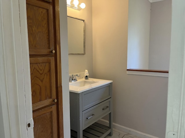 bathroom featuring vanity and baseboards