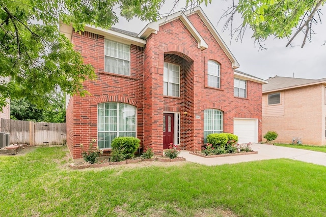 colonial home featuring fence, an attached garage, a front lawn, brick siding, and concrete driveway