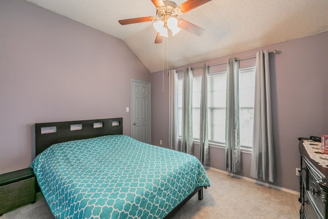 bedroom featuring ceiling fan, light colored carpet, and vaulted ceiling