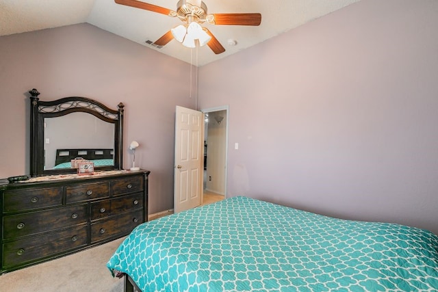 bedroom with a ceiling fan, vaulted ceiling, carpet flooring, and visible vents