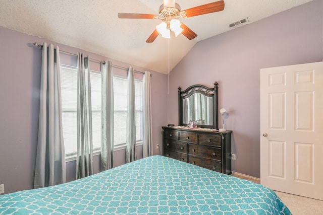 bedroom with carpet floors, baseboards, a ceiling fan, and vaulted ceiling