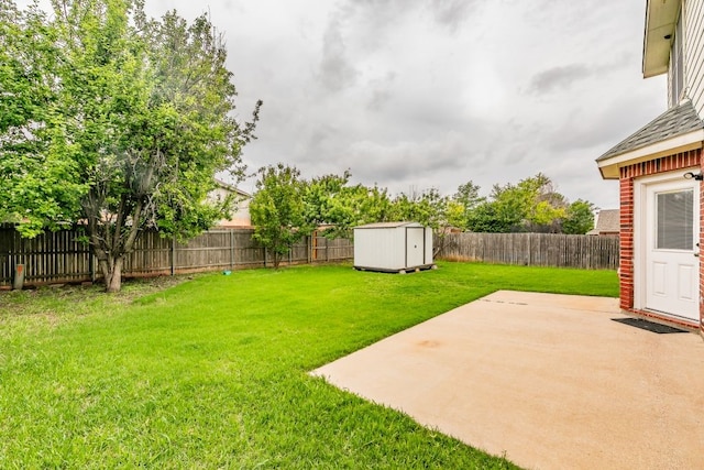 view of yard featuring a storage shed, a patio, an outbuilding, and a fenced backyard