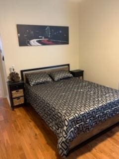 bedroom with wood finished floors
