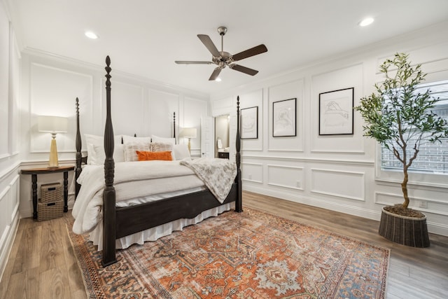 920 Plaza Ln, Argyle, TX 76226 - bedroom featuring a decorative wall, crown molding, wood finished floors, recessed lighting, and a ceiling fan