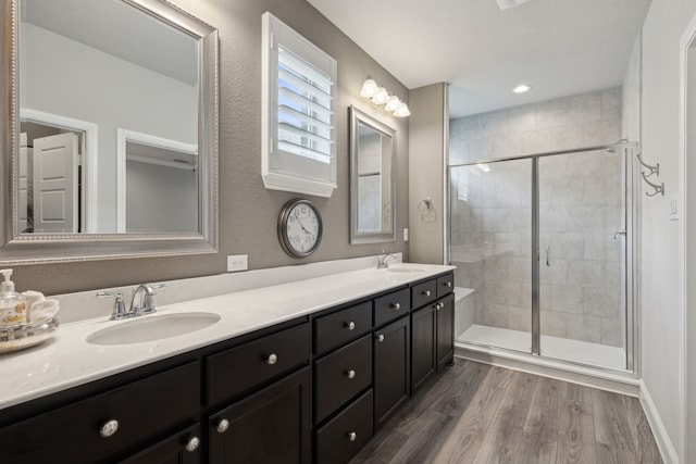 920 Plaza Ln, Argyle, TX 76226 - bathroom with a shower stall, double vanity, wood finished floors, and recessed lighting