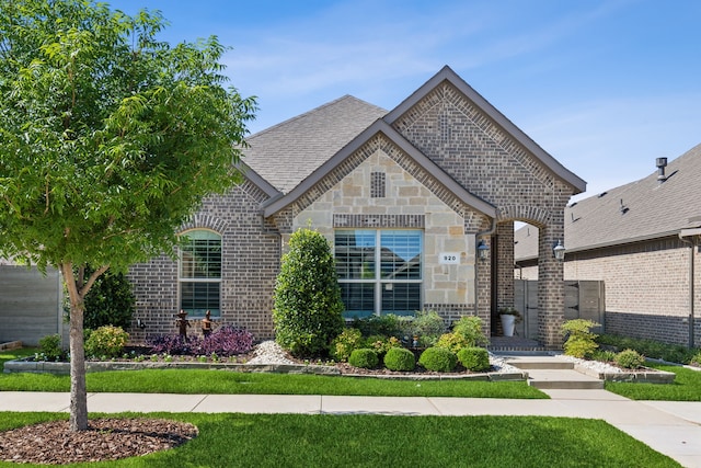 920 Plaza Ln, Argyle, TX 76226 - french country style house featuring brick siding, a front lawn, and stone siding