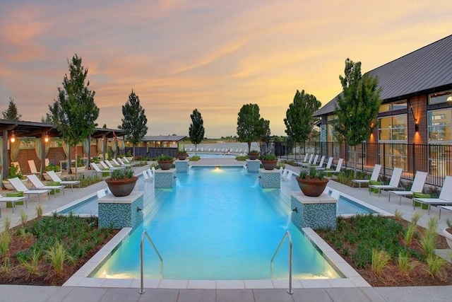 920 Plaza Ln, Argyle, TX 76226 - pool at dusk with a community pool, a patio area, and a hot tub
