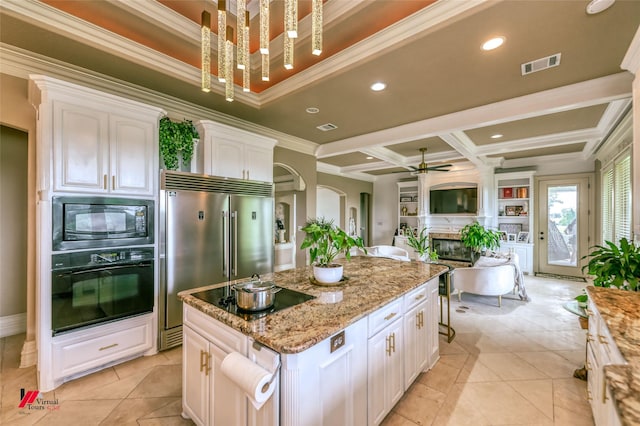 kitchen featuring ceiling fan, visible vents, black appliances, ornamental molding, and coffered ceiling