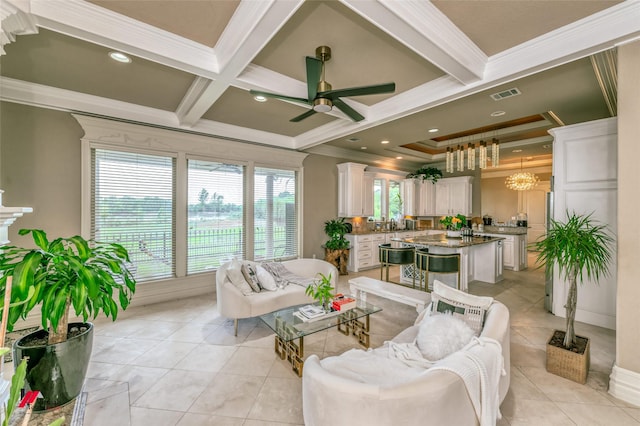 living area with a ceiling fan, crown molding, beam ceiling, coffered ceiling, and light tile patterned flooring