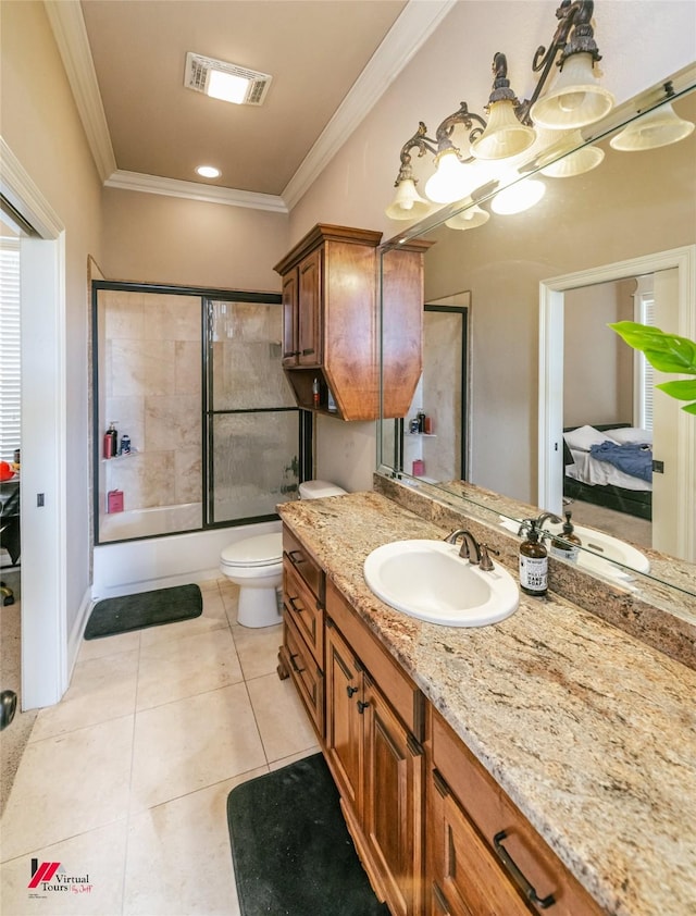 ensuite bathroom with visible vents, tile patterned flooring, vanity, toilet, and ornamental molding