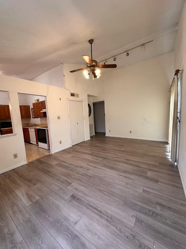 4757 China Rose Dr, Fort Worth, TX 76137 - unfurnished living room featuring high vaulted ceiling, a ceiling fan, baseboards, wood finished floors, and visible vents
