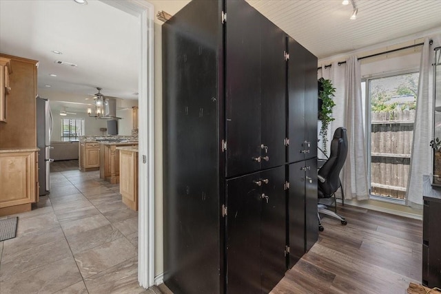 office space featuring a ceiling fan and visible vents