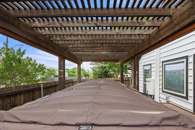 view of patio / terrace featuring fence and a pergola