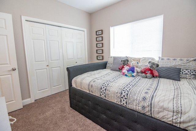 carpeted bedroom with a closet