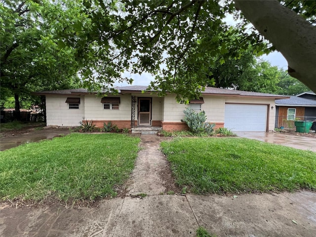 ranch-style house with a shingled roof, a front lawn, brick siding, a garage, and concrete driveway