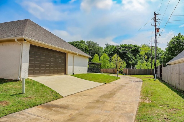 view of side of property with brick siding, fence, and a shingled roof