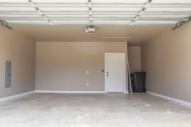 garage with baseboards, a garage door opener, and electric panel