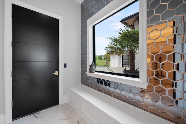 interior space featuring marble finish floor