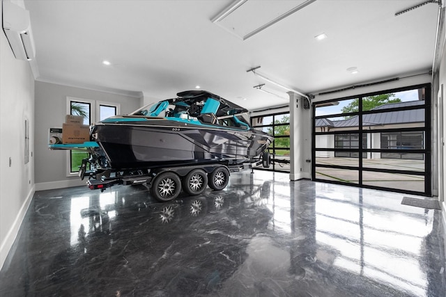 garage featuring an AC wall unit and baseboards
