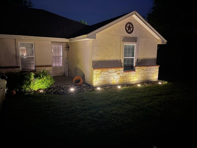 250 Ashland Dr, Woodway, TX 76712 - exterior space featuring stucco siding, a yard, and stone siding