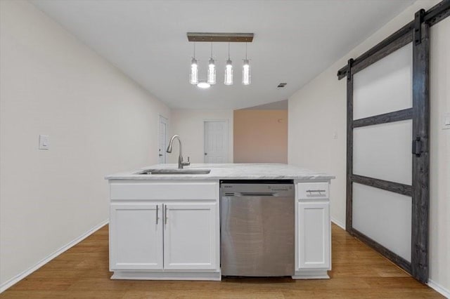250 Ashland Dr, Woodway, TX 76712 - kitchen featuring white cabinetry, a barn door, a sink, and dishwasher