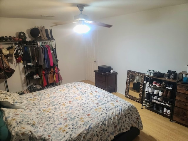 250 Ashland Dr, Woodway, TX 76712 - bedroom featuring visible vents, ceiling fan, and wood finished floors