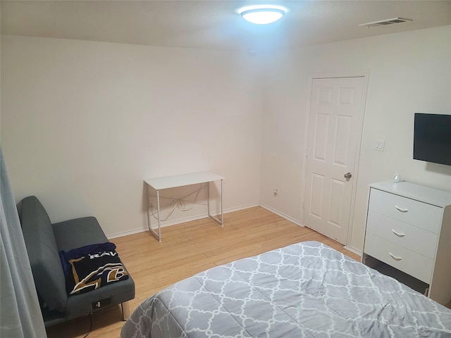 250 Ashland Dr, Woodway, TX 76712 - bedroom with baseboards, visible vents, and light wood-type flooring