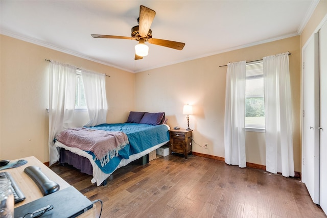 bedroom featuring baseboards, ornamental molding, ceiling fan, and hardwood / wood-style flooring