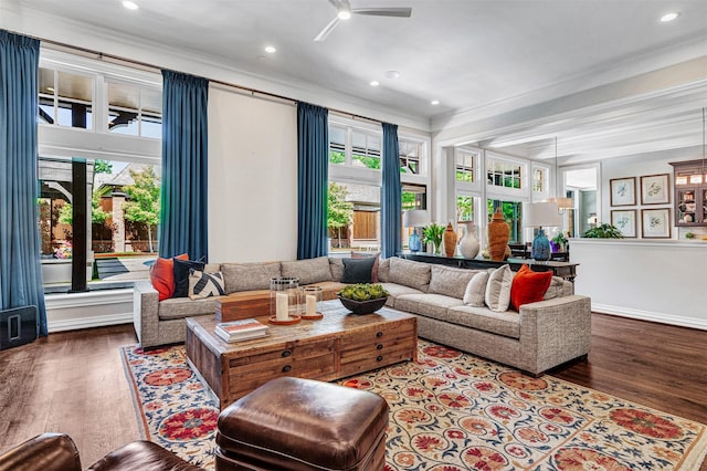 living room with recessed lighting, ornamental molding, and a wealth of natural light