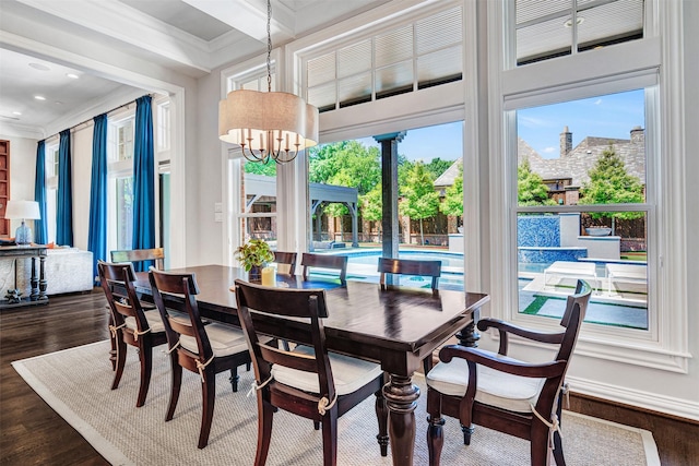 dining room with crown molding, recessed lighting, dark wood finished floors, and an inviting chandelier