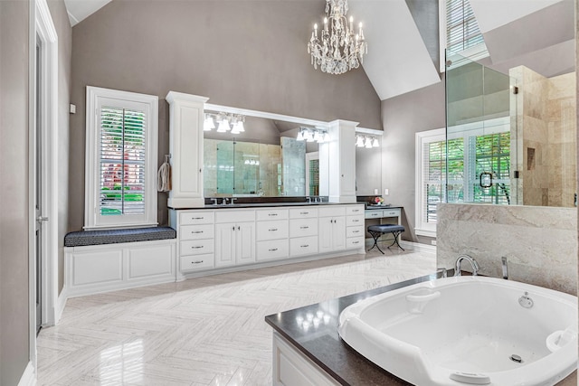 full bathroom with a bath, high vaulted ceiling, vanity, a notable chandelier, and tiled shower