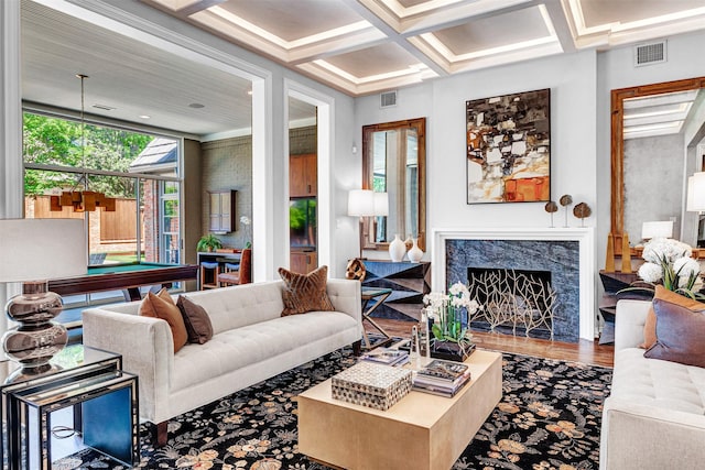 living area with billiards, visible vents, a fireplace, wood finished floors, and coffered ceiling
