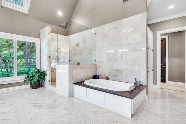 full bathroom featuring recessed lighting, tile walls, ornamental molding, a bath, and a stall shower