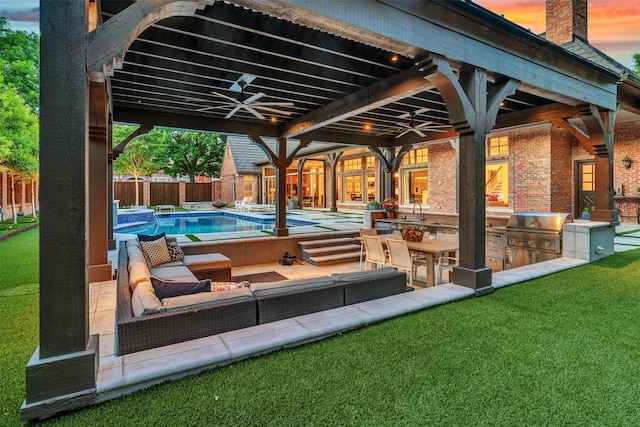 view of patio / terrace featuring ceiling fan, area for grilling, a fenced backyard, a fenced in pool, and a grill