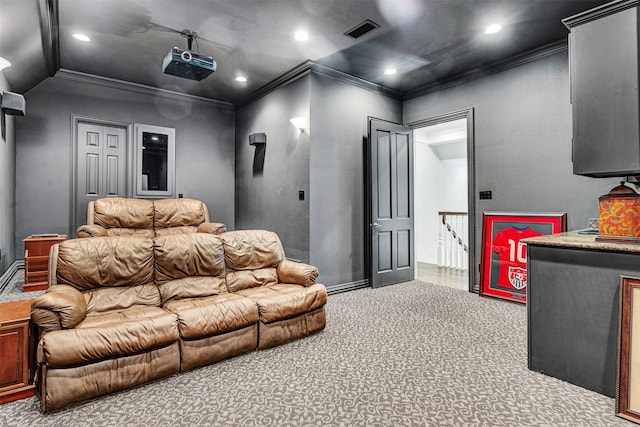 carpeted home theater with baseboards, ornamental molding, recessed lighting, and visible vents