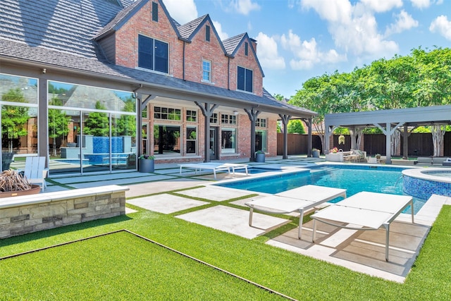 view of pool featuring a gazebo, a pool with connected hot tub, a fenced backyard, a patio, and a yard
