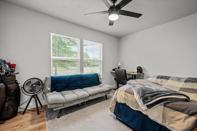 bedroom featuring a ceiling fan and wood finished floors