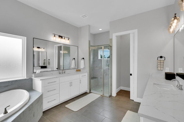 full bathroom with vanity, recessed lighting, tile patterned floors, a shower stall, and tiled bath