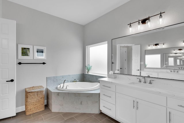 full bath with a bath and vanity