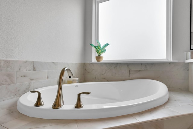 bathroom featuring a tub
