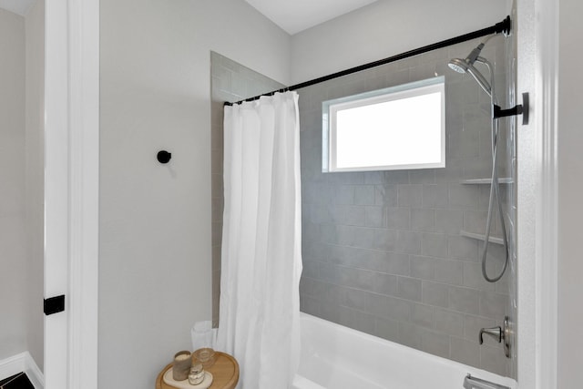 bathroom with shower / tub combo