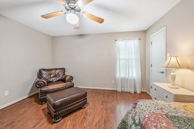 bedroom featuring baseboards, a ceiling fan, and wood finished floors