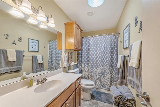 full bath featuring stone finish floor, visible vents, vanity, toilet, and a shower with shower curtain
