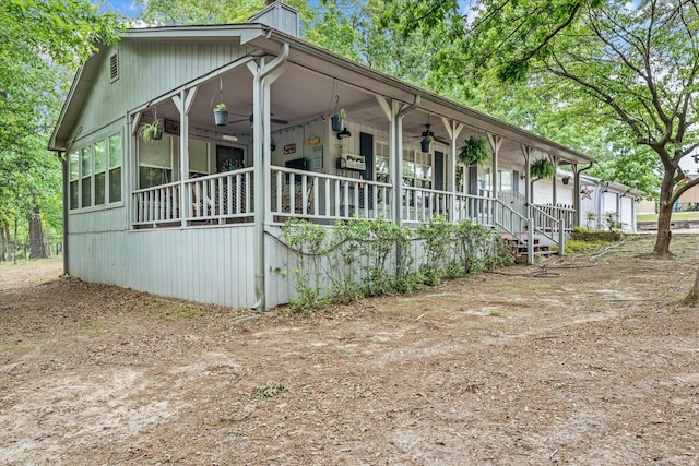 view of front of property featuring covered porch and a ceiling fan