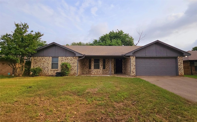 ranch-style house with concrete driveway, a front lawn, and a garage