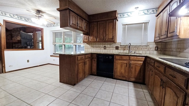 kitchen with ceiling fan, tasteful backsplash, a sink, black appliances, and under cabinet range hood