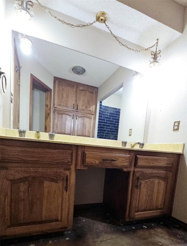 bathroom featuring concrete floors and vanity