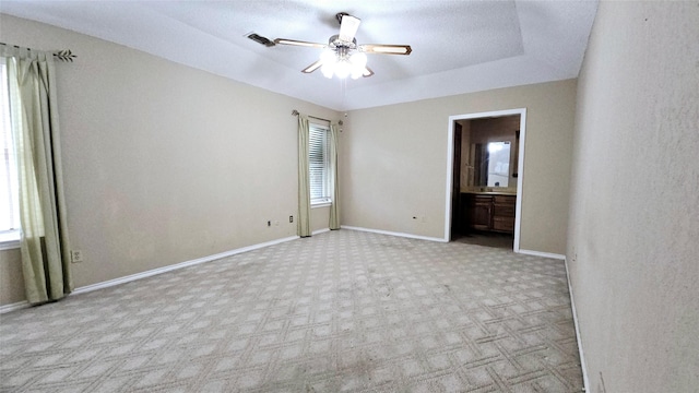 unfurnished room with ceiling fan, plenty of natural light, and carpet
