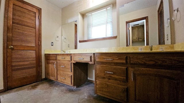 full bathroom featuring vanity and concrete flooring