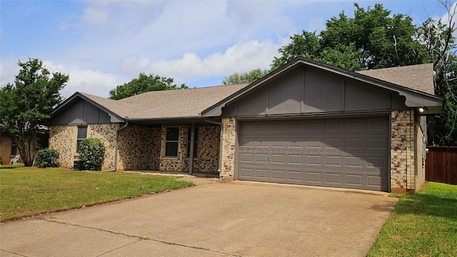 ranch-style house with a front lawn, fence, roof with shingles, concrete driveway, and an attached garage
